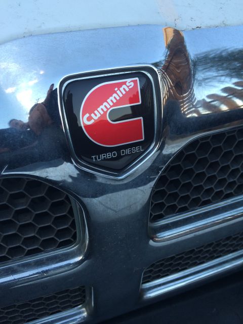 1997 Dodge 3500 - Close-up of a Cummins Turbo Diesel emblem on a truck's front grille.