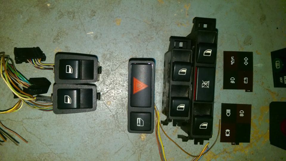 BMW window switches, hazard light switch, and other interior control buttons with wiring