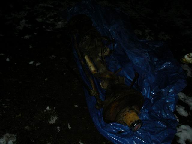 Dana 60 axle assembly covered in blue tarp on the ground