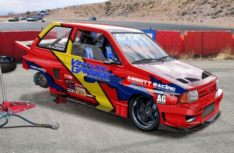 1991 Ford Festiva - A heavily modified red and yellow race car, possibly a Ford Festiva, is shown on jack stands with racing decals and sponsors visible.