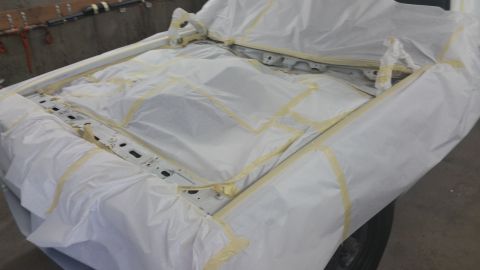 1991 Ford LTD Crown Victoria - Vehicle chassis is masked and taped, ready for paintwork.