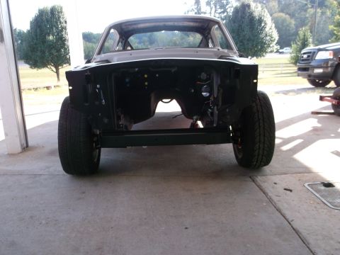1967 Ford Mustang - Front view of a 1967 Ford Mustang undergoing restoration, with the engine bay and front clip removed.