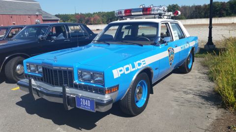 1991 Ford LTD Crown Victoria - This police car has "POLICE" written on its side and a "NYC POLICE" license plate.