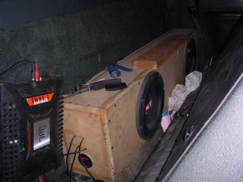 1990 Ford F-150 - Custom car audio setup JBL amplifier and dual subwoofer enclosure.