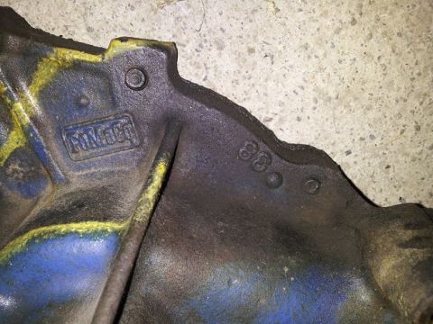 1968 Ford Mustang - A cast iron Ford part displays a 'FORD' logo and a '68' casting date, indicating it is from 1968.