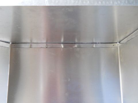 1992 Ford Bronco - The interior of a metal box shows seams and rivets, with a watermark for Supermotors.net.