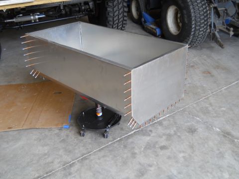 1992 Ford Bronco - A custom metal fabrication project is shown in a garage setting with vehicle components visible.