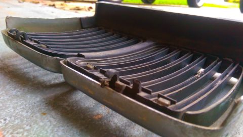 1989 BMW 3 Series - Car grille part with horizontal slats and metal trim, likely from an older vehicle.