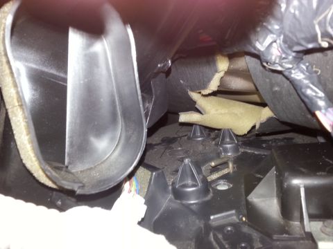 2003 Ford Crown Victoria - Close-up view of interior HVAC ductwork and components, with a SuperMotors logo visible at the bottom right.