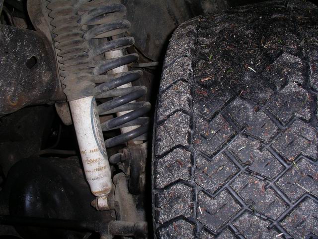 1990 Ford F-150 front suspension with coilover shock and tire