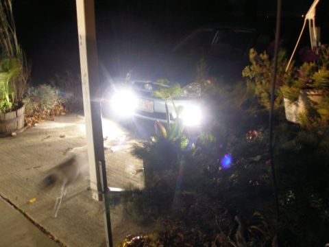 2008 Hyundai Accent - Car parked at night with bright headlights illuminating the front.