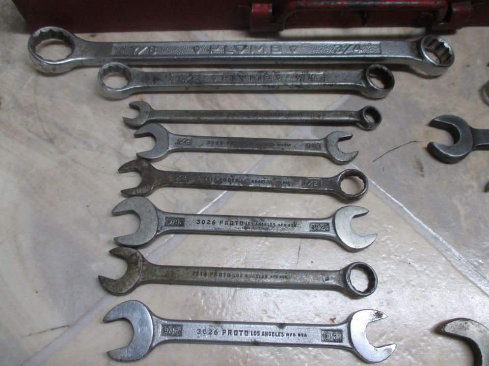 Collection of wrenches with visible brand names like PLYMOUTH and PROTO