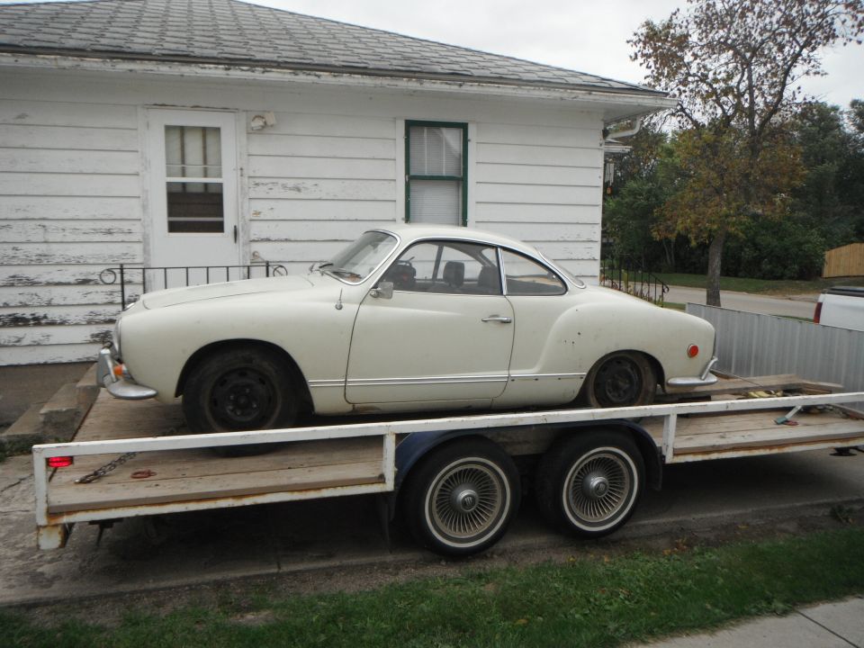 White 1969 Volkswagen Karmann Ghia on a trailer, side view