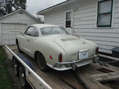 1969 Volkswagen Karmann Ghia - Rear view of a 1969 Volkswagen Karmann Ghia being transported on a trailer.