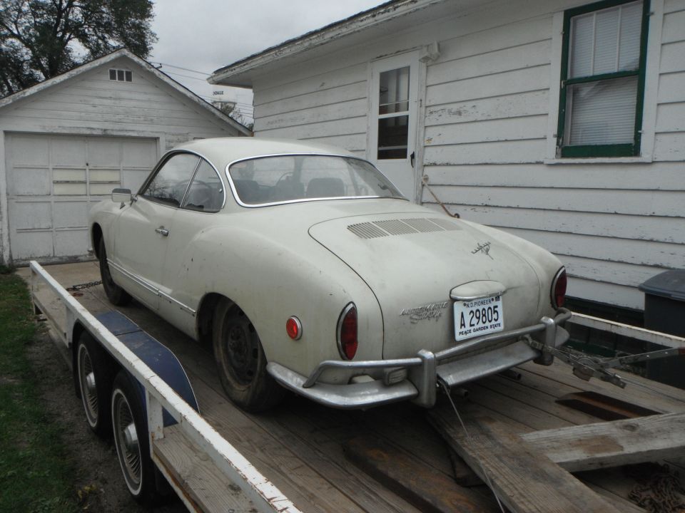 1969 Volkswagen Karmann Ghia on a trailer, rear view. White car with California plate A 29805