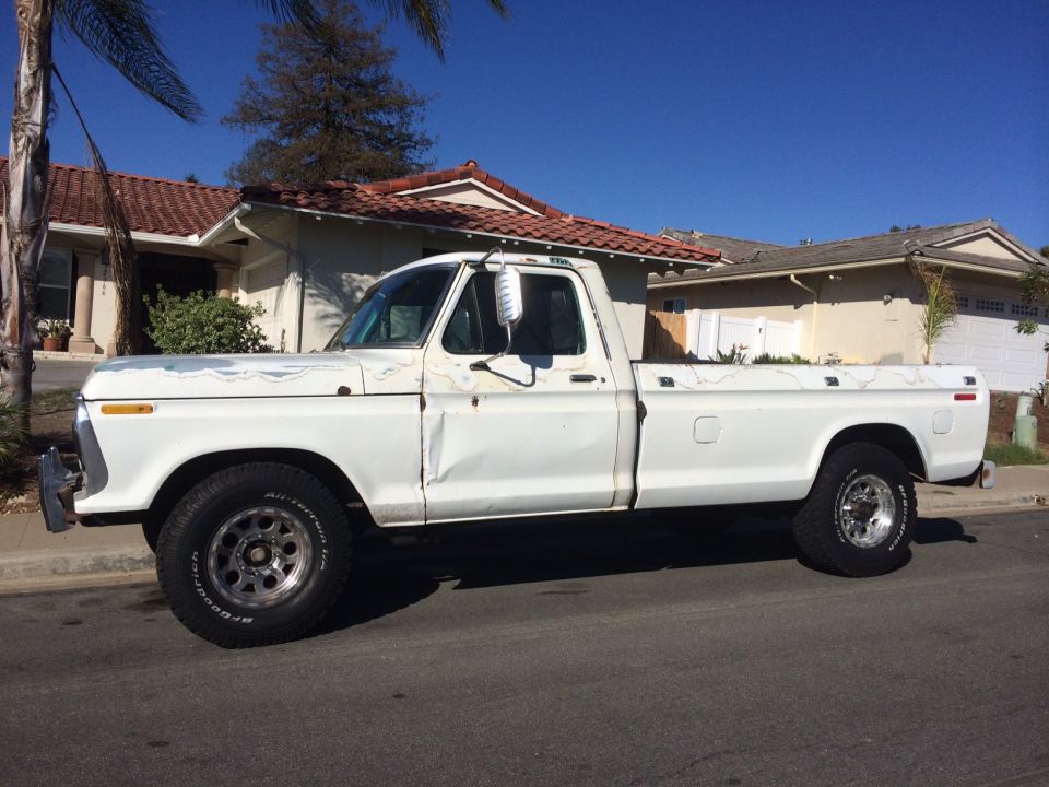 White 1977 Ford F-350 pickup truck, side view