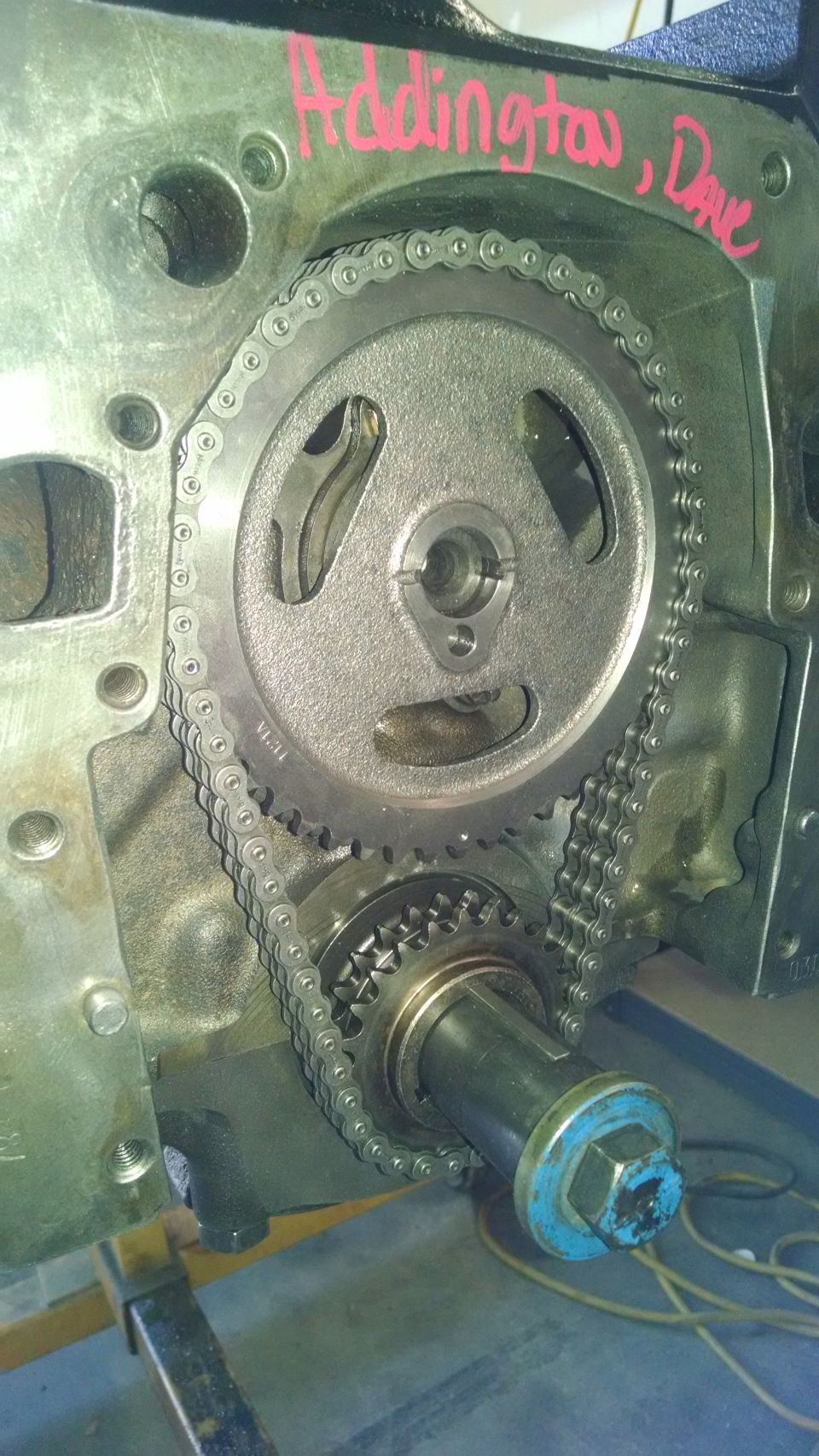 Engine block with timing chain and gears, red marker text 'Addington, Dave' visible