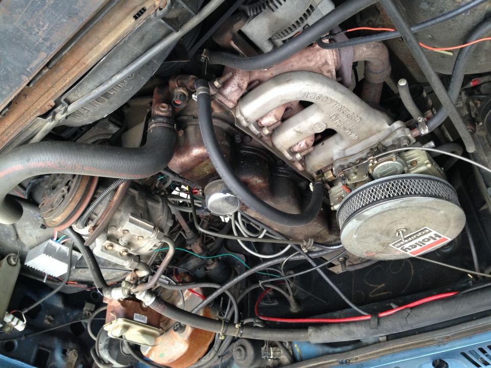 Engine bay with Holley carburetor and air filter