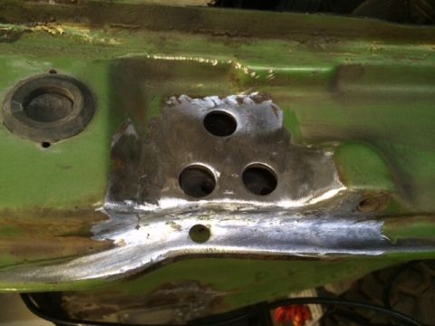 1988 Suzuki Samurai - Frame section showing repair work and drilled holes.