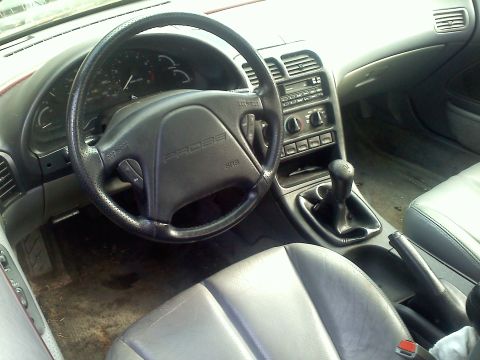 1993 Ford Probe - Interior view of a 1993 Ford Probe GT, highlighting the dashboard, steering wheel, and shifter.