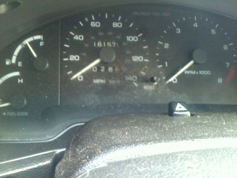 1993 Ford Probe - The vehicle's dashboard displays the odometer reading of 161,570 miles and a fuel gauge.