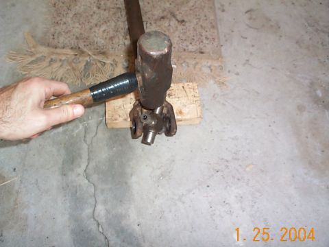 1992 Ford Bronco - Took a 5 pound sledge hammer, placed the base of the ears on a block of wood, and hit the u-joint.