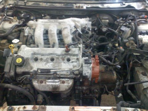 1993 Ford Probe - Close-up view of a Ford engine, likely from a 1993 model, showing engine components and wiring.