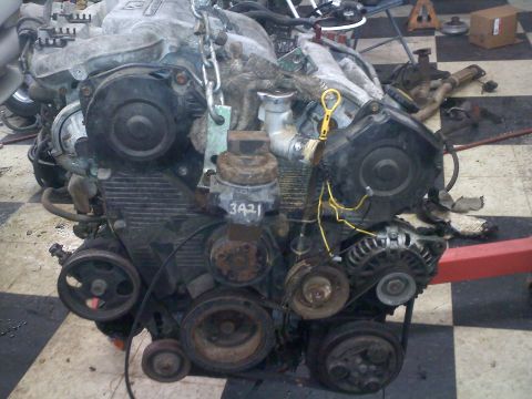1993 Ford Probe - Engine assembly with various components attached, including pulleys and alternator. Part number 3421 is visible.