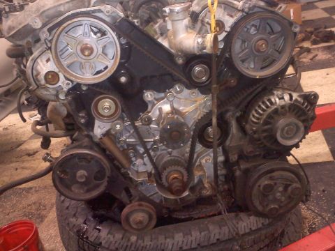 1993 Ford Probe - Close-up view of an engine's internal components and timing belt system.