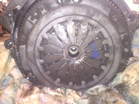 1993 Ford Probe - This is a close-up view of a vehicle's clutch assembly, showing the pressure plate and flywheel components.