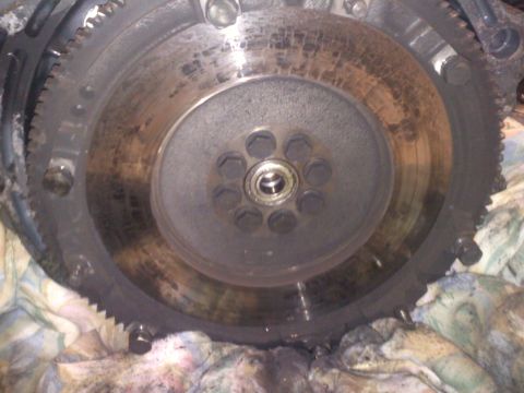 1993 Ford Probe - Close-up view of an engine flywheel, showing wear and bolt patterns. The registry information may be inaccurate.