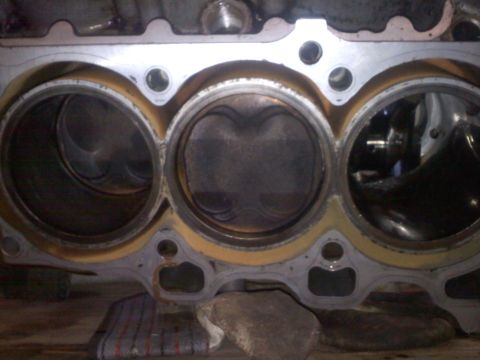 1993 Ford Probe - Close-up view of an engine block showing pistons within cylinders.