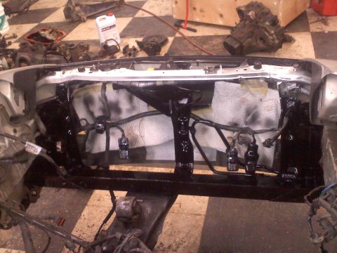 1993 Ford Probe - Engine bay disassembled for maintenance, with various components and wiring visible.