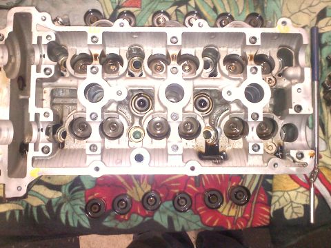 1993 Ford Probe - Close-up view of an engine cylinder head, showing internal mechanical components.