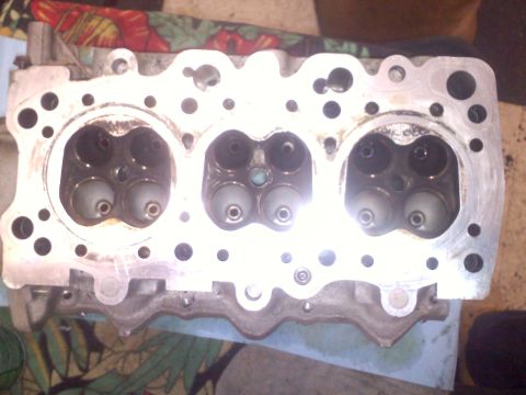 1993 Ford Probe - Close-up view of an engine cylinder head, showing the intake and exhaust valves.