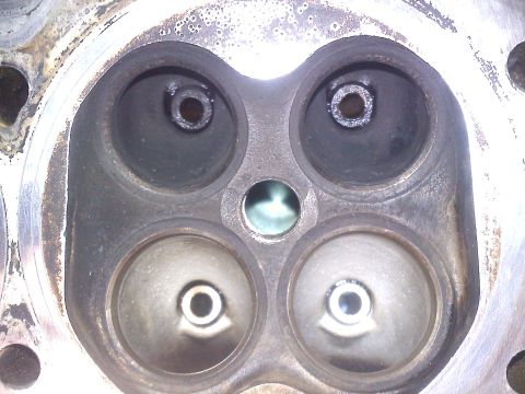 1993 Ford Probe - Close-up view of an engine cylinder head showing intake and exhaust ports.