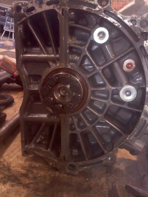 1993 Ford Probe - Disassembled engine component showing internal structure and fasteners.