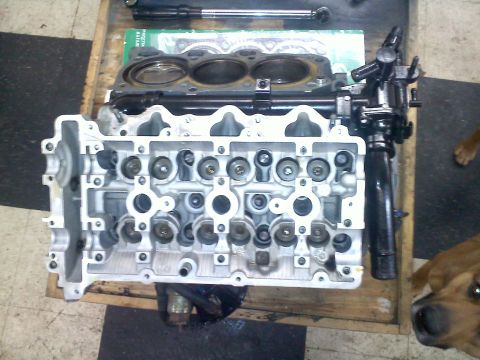 1993 Ford Probe - Close-up of an engine cylinder head, likely undergoing repair or maintenance.
