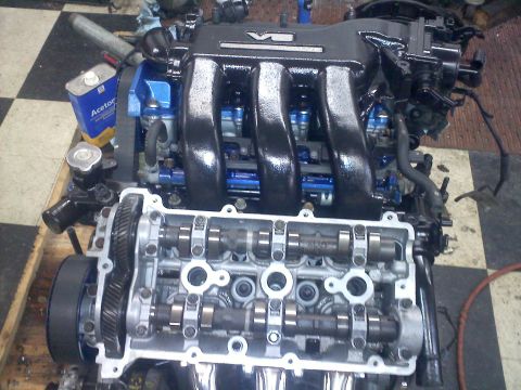 1993 Ford Probe - Engine assembly with V6 intake manifold and visible camshafts.