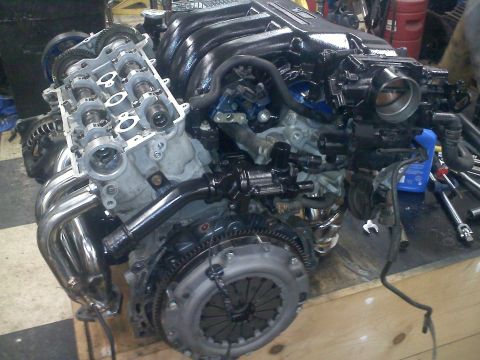 1993 Ford Probe - This is a close-up view of an engine assembly, likely undergoing maintenance or rebuild.