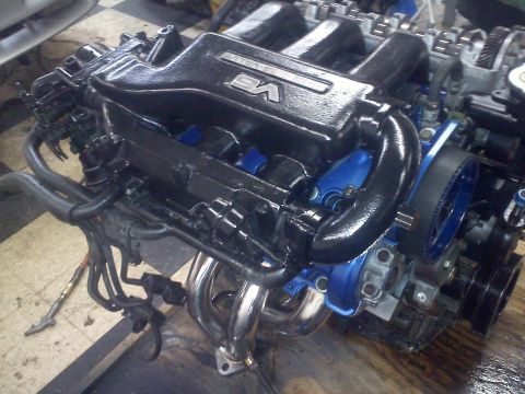 1993 Ford Probe - Engine with V6 branding visible on the intake manifold, likely a performance part.