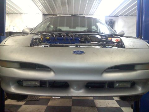 1993 Ford Probe - Front view of a silver 1993 Ford Probe with its hood open, revealing the engine bay.