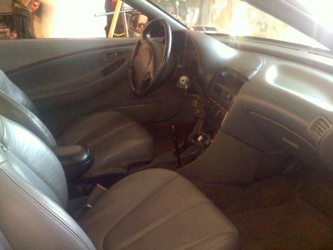 1993 Ford Probe - Interior view of a 1993 Ford Probe, highlighting the dashboard and seating arrangement.