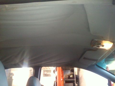 1993 Ford Probe - Interior view of a car's headliner, showing signs of wear and tear.