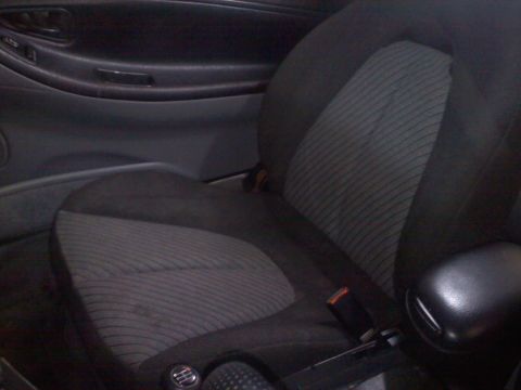 1993 Ford Probe - Close-up of a car's interior, focusing on the seat and door panel details.