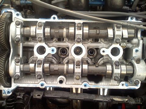 1993 Ford Probe - Close-up view of an engine's valve train, showing camshafts and associated components.