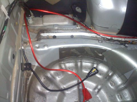 1993 Ford Probe - Interior view of a car's trunk area with visible wiring and spare tire well.