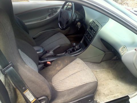 1993 Ford Probe - Interior view of a car, showing the dashboard, seats, and center console.