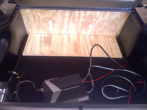 1993 Ford Probe - The trunk interior shows a Power Acoustic amplifier and custom wood paneling, with visible wiring.