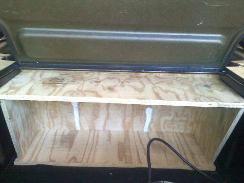 1993 Ford Probe - Custom wooden storage box built into the cargo area of a vehicle.